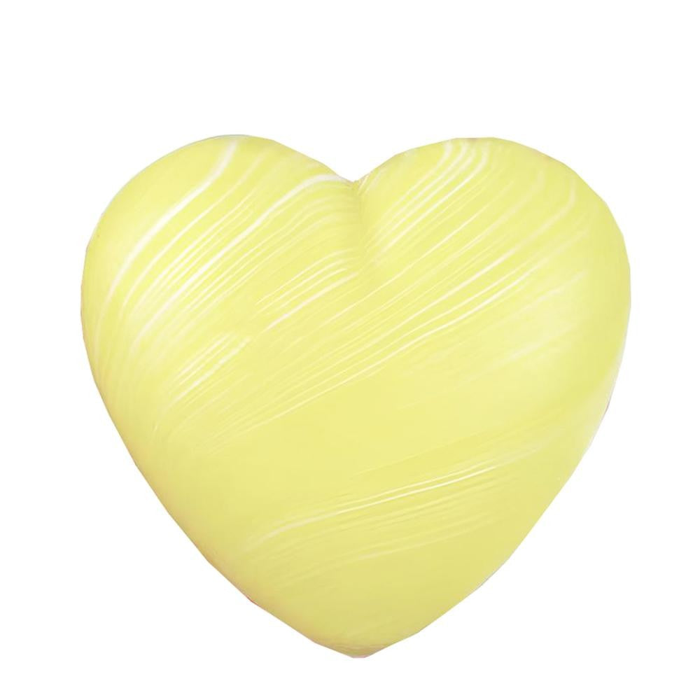 Yellow heart-shaped squishy on a white background