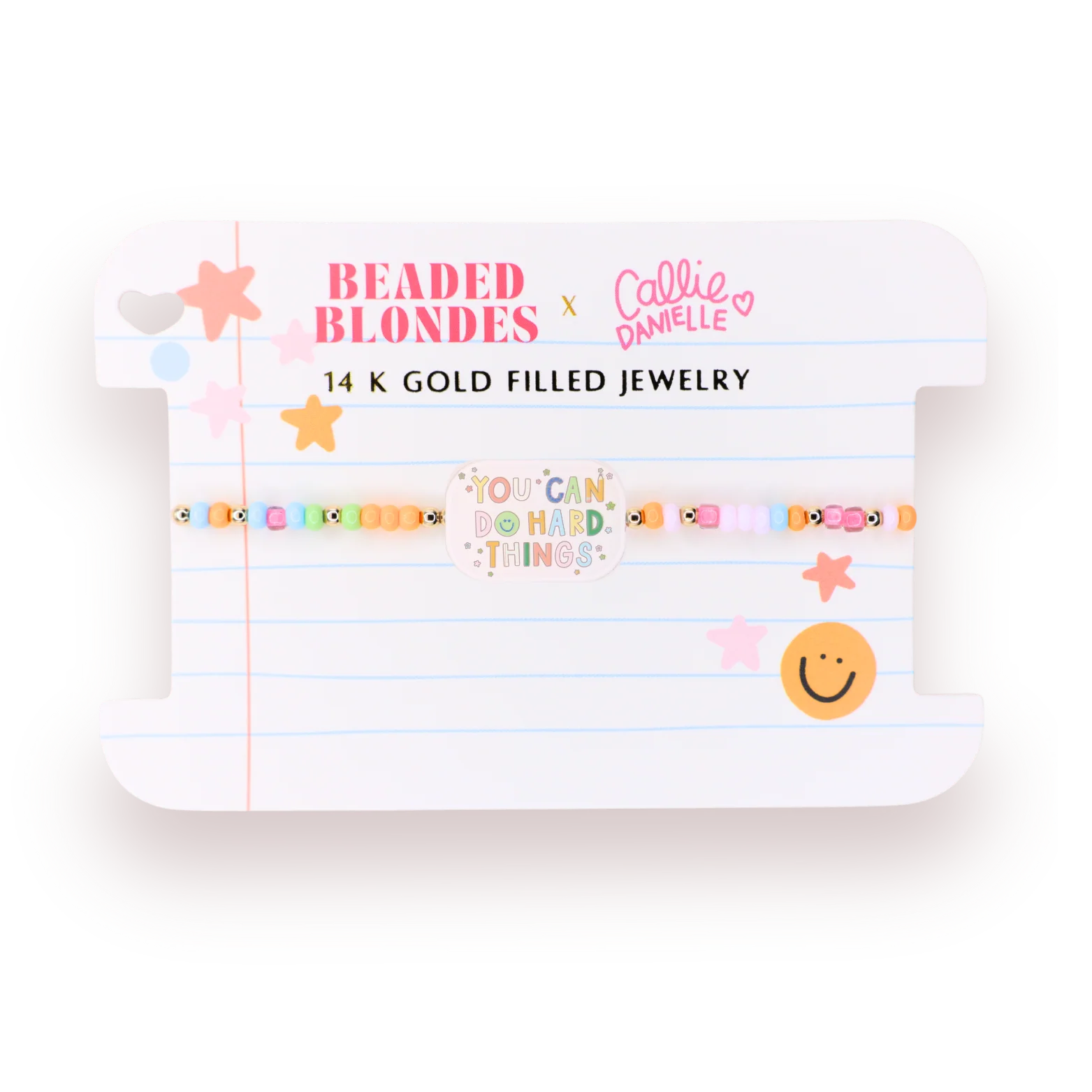 A beaded bracelet displayed on a white card backing. The bracelet features pastel-colored beads with small gold-toned fish details and is flanked by gold star-shaped embellishments.
