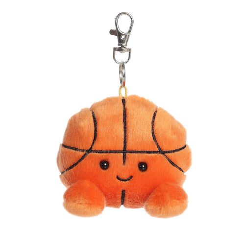 A cute orange plush basketball keychain with a smiling face and black stitched lines, attached to a silver metal lobster clasp on a white background.
